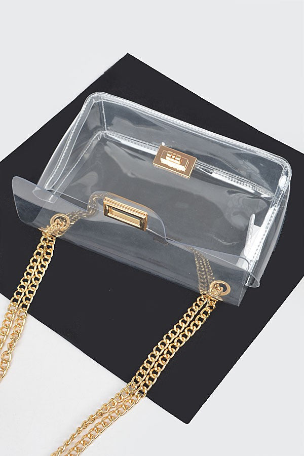 Transparent flap crossbody bag interior with gold chain hardware